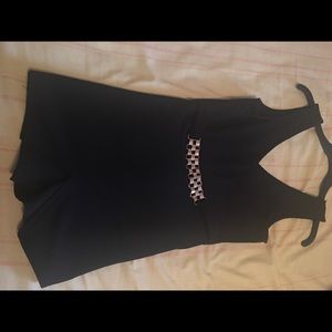 Black romper with attached gold belt